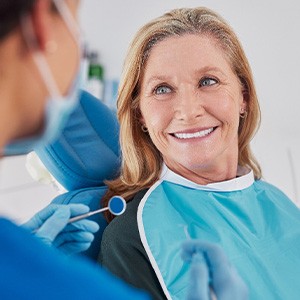 a woman speaking with a dentist