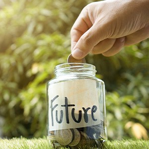 a jar labeled “future” with change in it