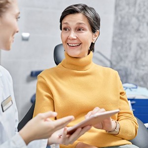 Dentist and patient engaged in conversation during consultation