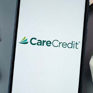 a CareCredit logo on a phone