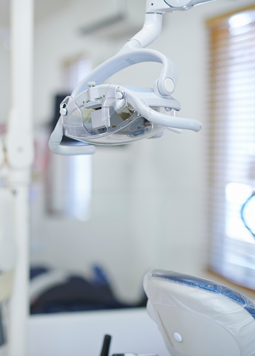 Dental operating light over treatment chair