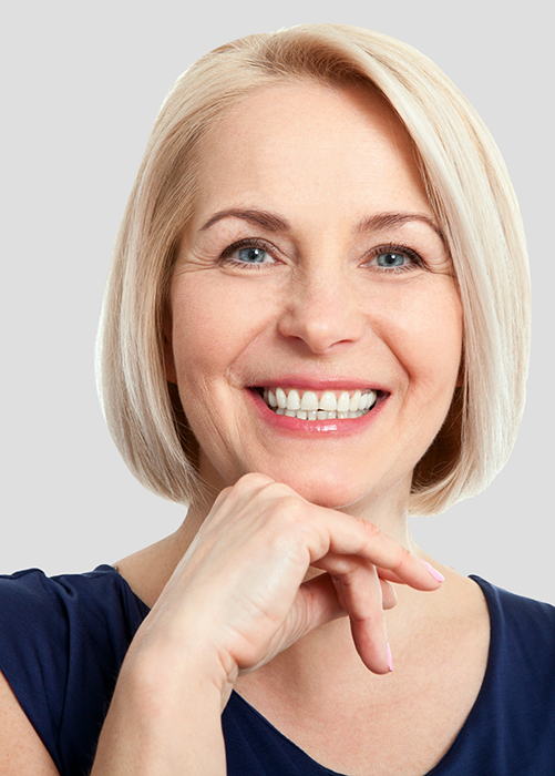 Older woman with blonde hair smiling