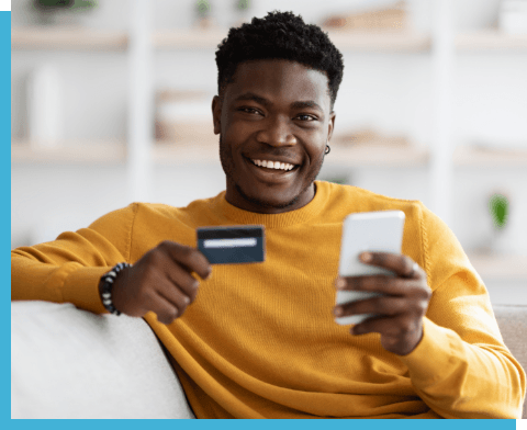 photo of man smiling with payment card