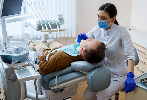 Male patient visiting dentist for preventive dentistry in Plano