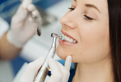 Close up of woman having her teeth cleaned
