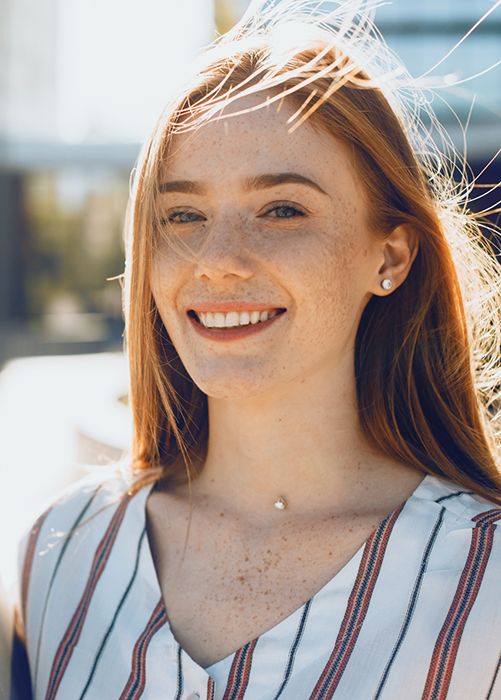 Woman in striped shirt smiling